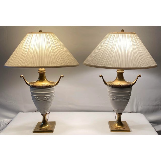 Lovely pair of white ceramic urn shaped table lamps. These stylish ceramic table lamps would enhance any side tables,...