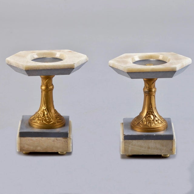 Pair of marble stands have gilded bronze columns with classic Art Nouveau stylized floral motif. Circa 1910.