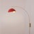 The Luna Bella Wall Arc Lamp is a striking arc lamp featuring a weathered brass steel body and a unique half-dome red/gold...