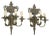 A refined pair of Italian Louis XVI style three-light wall sconces featuring classical urn-form crowns, scrolling arms,...