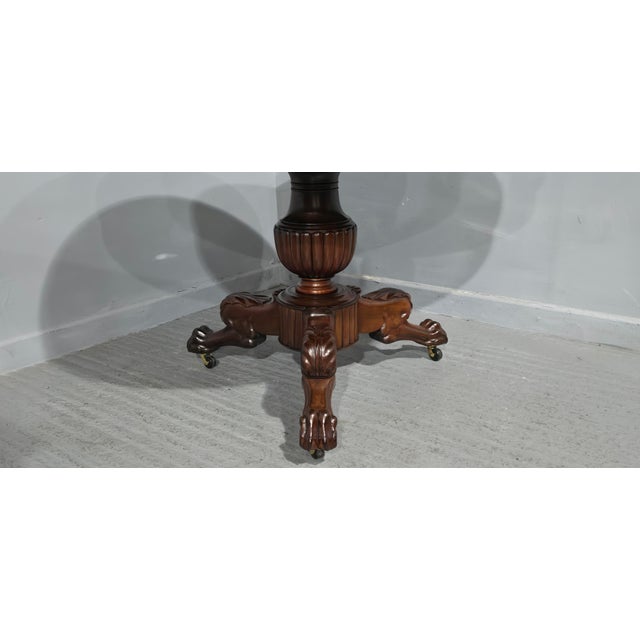 A very nice French mahogany gueridon table on brass castors, with verigated marble top, lovely colour and condition. 30"...