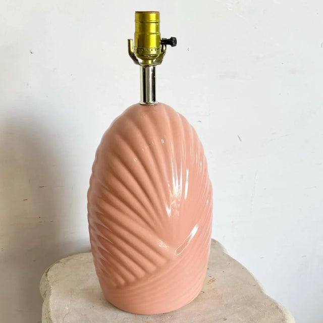 Illuminate your space with the unique and stylish Postmodern Sculpted Coral Pink Scalloped Table Lamp. This lamp features...