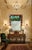 Make a striking, high-design statement with this large-scale wall mirror featuring a rich leather frame accented by...