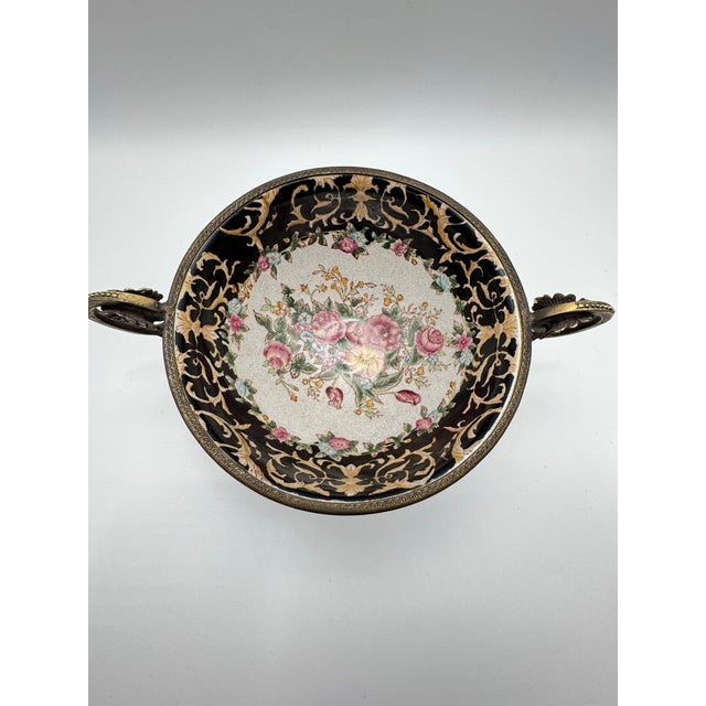 The product is a Chinese export crackle glaze centerpiece with ormolu style handles. The intricate design and...