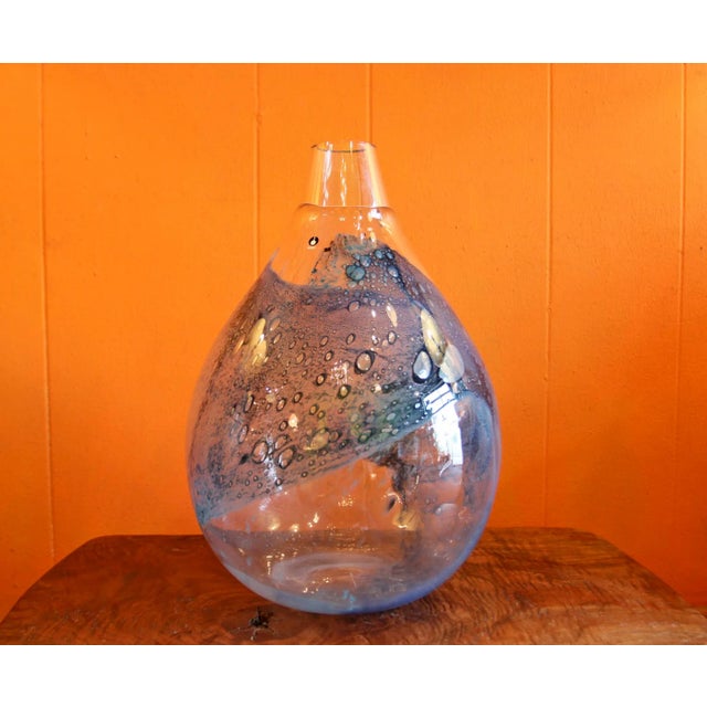 Absolutely stunning, art glass vase by Eva Englund for Pukeberb , Sweden. There are no cracks, or nicks to the vase, in it...