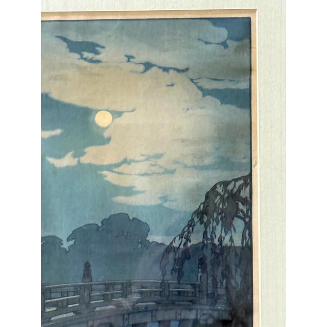 A Japanese woodblock print by Yoshida Hiroshi (1876-1950), entitled "Hirakawa Bridge". Part of his iconic series "Twelve...