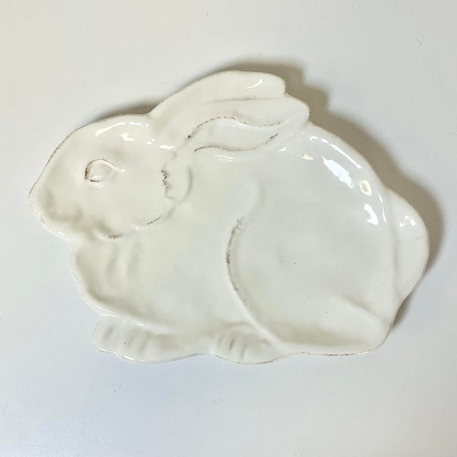This is a whimsical Bunny Plate. It has a white glaze over a terra cotta ceramic pottery. It’s perfect for Easter...