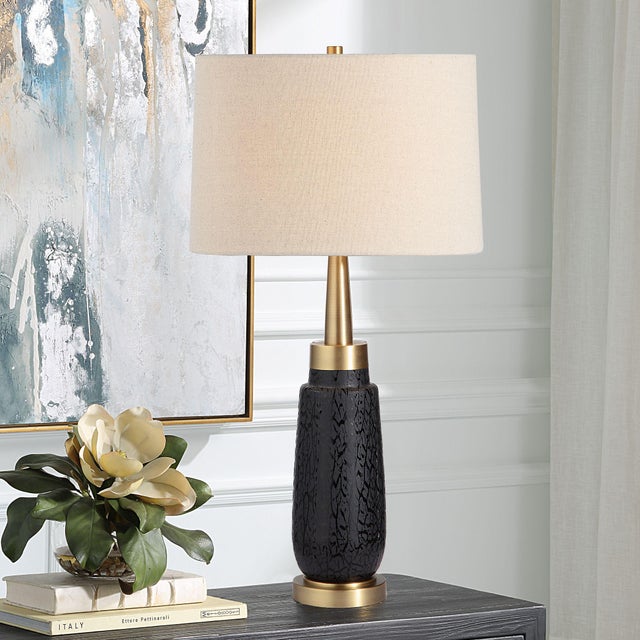 The Spyglass Table Lamp Features A Matte Black Glass Base With Polished Black Woodgrain-like Etching, Paired With Lightly...