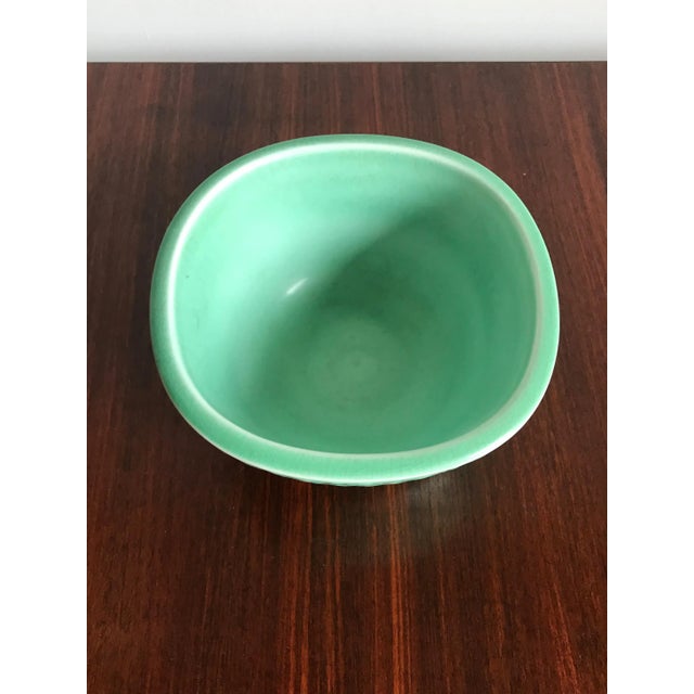 This green Danish ceramic vase bowl, series “Marselis”, was designed by Nils Thorsson for Royal Copenhagen in the 1950s....