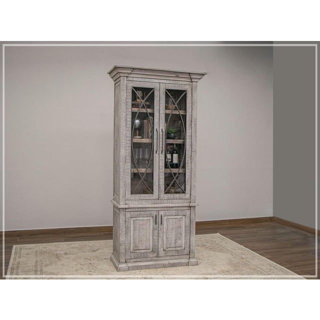 The Azzaria cabinet is made of solid pine wood with beautiful straight lines. Ready to showcase your books or any other of...