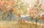Serene landscape by J. B. Schock. Several trees line the banks of a river, bursting with fall colors. Across the river on...