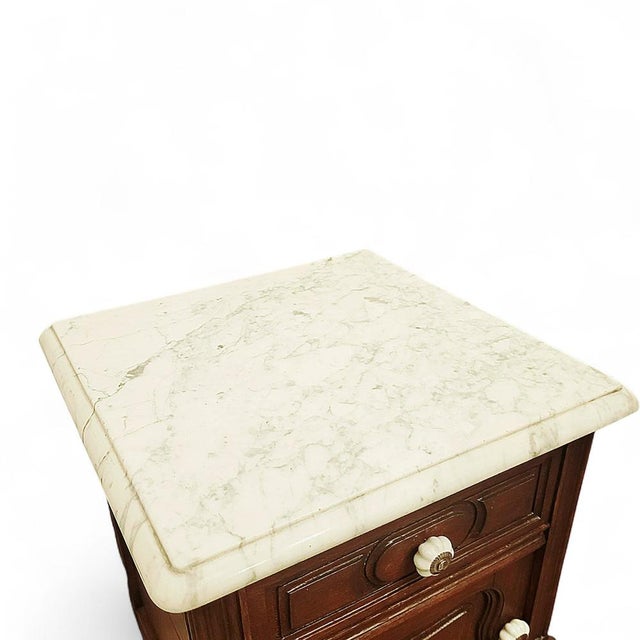 Bring instant Parisian charm to your interior with this vintage French Louis XV style bedside table, a beautifully...