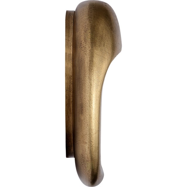 Esculpa 14" Rounded Wall Light in Museum Brass Designer: Kelly Wearstler Finish: Museum Brass Height: 14" Width: 12"...
