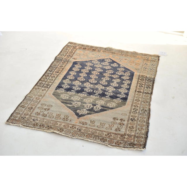 Name: Apricot, Peach, Grey, & Indigo Field of Boteh Antique Rug Size: 3.3 x 4.5 Age: Semi-Antique C. 1940's Pile: Low This...