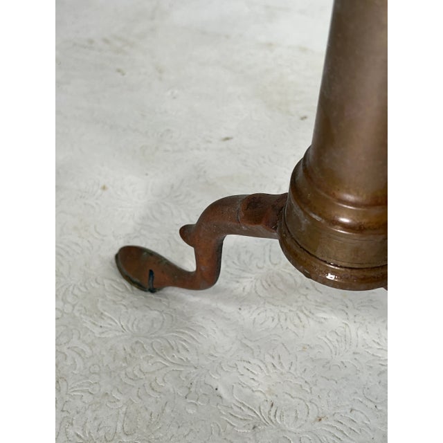 Vintage pair of andirons that are made out of brass and CastIron. The andirons are both marked bennett.