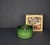 This 1970s Christmas tree stand is made of green glazed stoneware and features a striking diamond pattern typical of the...