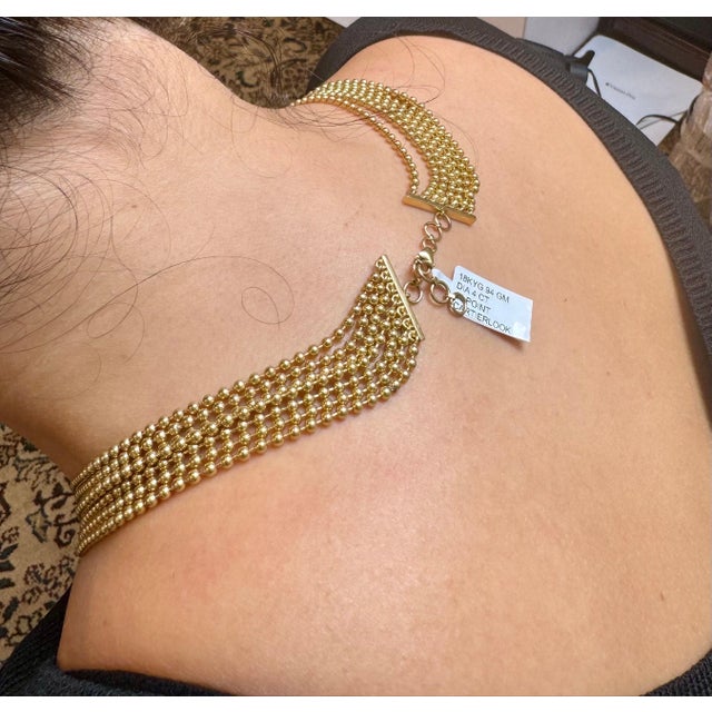 Experience the vintage charm of this exquisite 18 Kt Yellow Gold Cartier Look Design Necklace. This stunning piece...