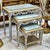 Elegant set of three French-style nesting tables featuring a beautiful soft sky blue finish accented with luxurious gold...