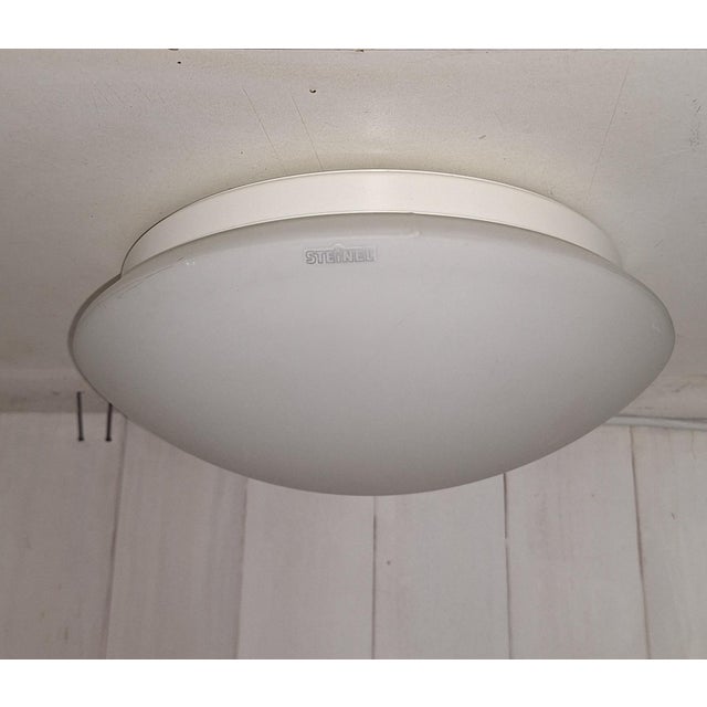 Flat Vintage Ceiling Lamp with White Opal Glass Shade from Steinel, 1980s, in Very Good conditions. Designed 1980 to 1989...