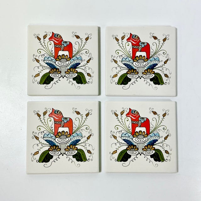 This set of four reconstituted stone tile coasters is from Sweden and features a Gustavian design on each. The design has...