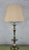 A handsome pair of American mid-century table lamps crafted in brass with a warm English brass finish. Their elegant...