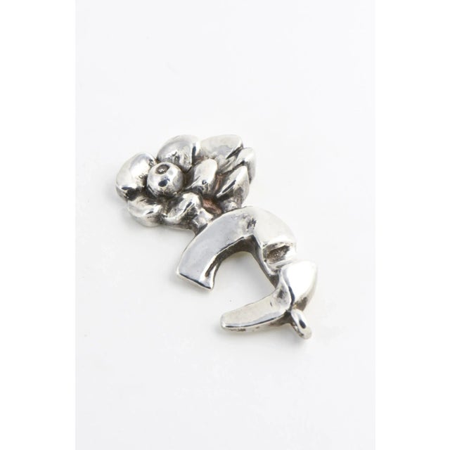 Sterling silver double-flower pendant designed by Israeli artist Rachel Gera. Signed on back: Rachel Gera 925.
