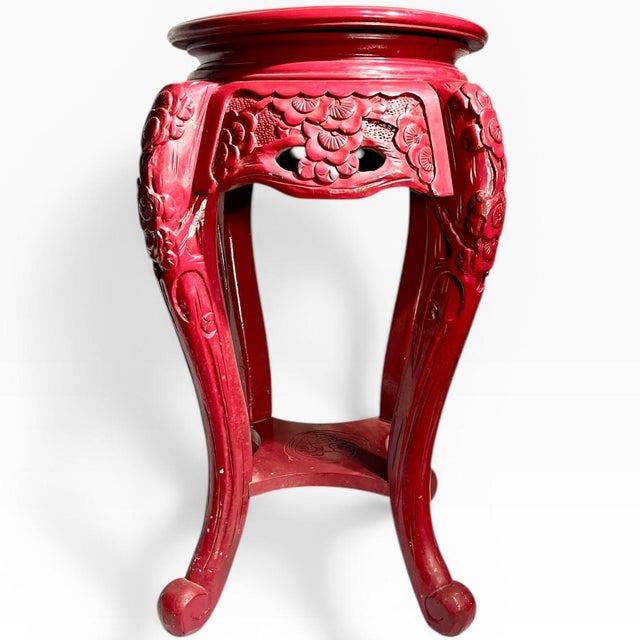 Vintage Chinese carved wood pedestal table that has been painted in a burgundy red. A traditional style Chinese table but...