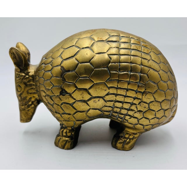 This charming vintage brass armadillo sculpture is a delightful addition to any eclectic or bohemian-inspired space....