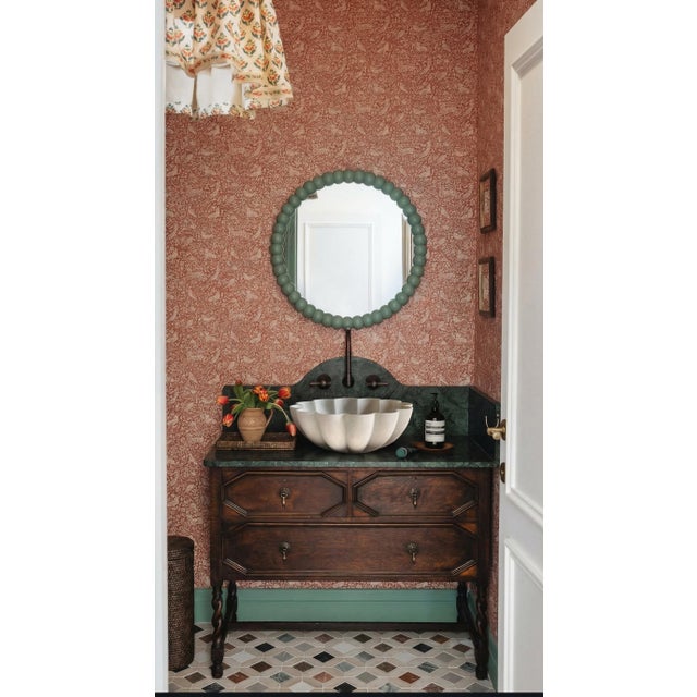This white marble sink is designed in a soft flower shape with gently curved, scalloped edges. The form feels natural and...
