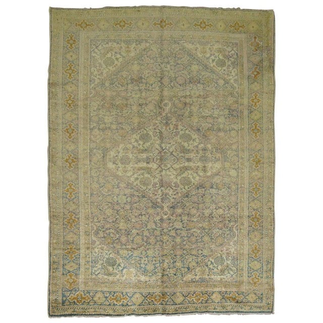 A Classic Persian mahal rug in sea foam colors with sprinkles of pink. Would make a great foyer piece!