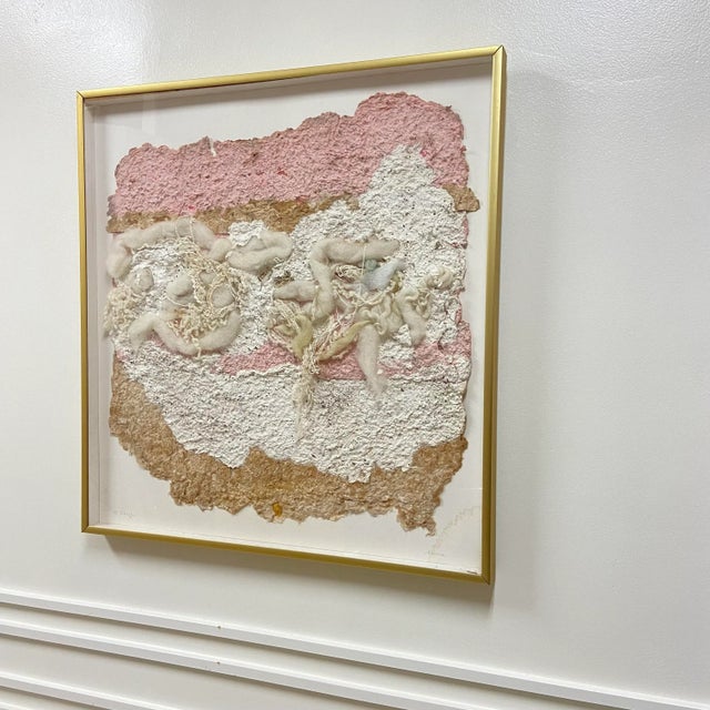 Vintage handmade paper and other various wool material and fiber art collage with pink, tan, and multi tonal cream colors....