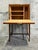 A refined Attributed to Frits Henningsen drop-front bar cabinet in beautifully figured teak, crafted in Denmark in the...