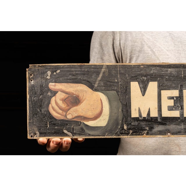Painted tin directional sign. This piece features hand-painted graphics and lettering and was likely meant for exterior use.