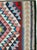 This Mid-20th century Persian flatweave kilim presents a bold, symmetrical composition centered on two large stacked...
