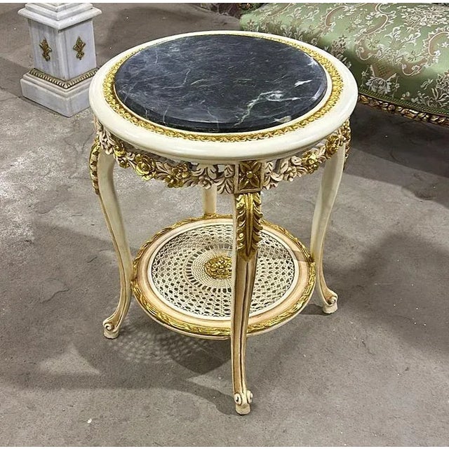 In love with the design. Beautiful white side table with gold details. This table can be used for decoration in the...