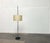 Rare Mid-Century Modern Cocoon floor lamp by Goldkant Leuchten with a distinctive shade pattern. The drum-shaped shade is...