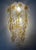 Marvelous, stunning and long italian set of three clear amber murano glass wall sconces from 1970s. These fixtures were...