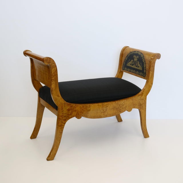 A handsome Baltic Neoclassical Karelian birchwood and ebonized fruitwood seat bench with fine figurative Boulle brass work...