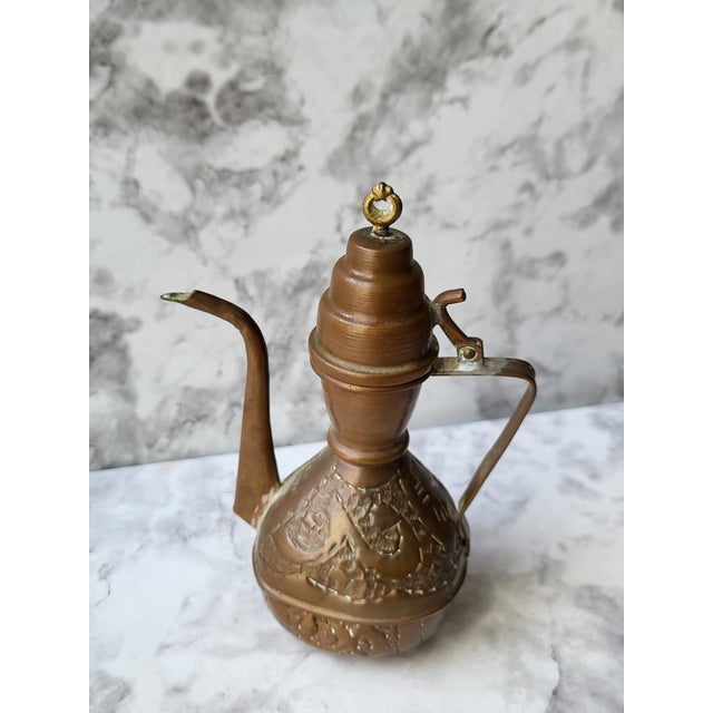 This is a beautifully etched copper coffee pot. It appears to be Middle Eastern Dallah in size and design. Would look...