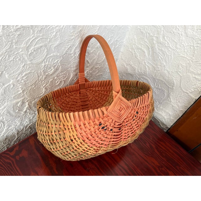Vintage 1980s woven watermelon basket with a bentwood handle over the top. Signed by maker. Please see condition details...