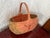 Vintage 1980s woven watermelon basket with a bentwood handle over the top. Signed by maker. Please see condition details...