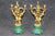 An exceptionally decorative French gilt-bronze and malachite three-piece clock garniture, conceived in the grand tradition...