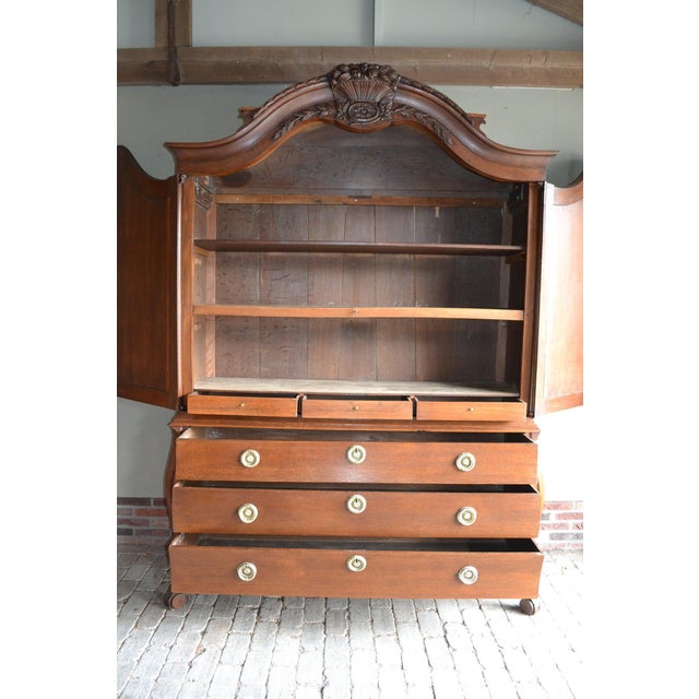 19th-century Dutch oak Biedermeier cabinet with a rounded front. The cabinet is partially disassemblable. The height is...