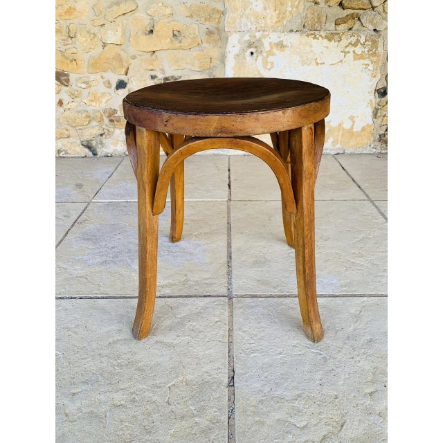 Mid-century, vintage, "Model #92" stool by Baumann, France, from the 1950's. Piece is made of beech, with a beautiful...