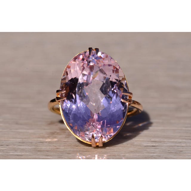 The Kable: Antique 18K Yellow Gold Kunzite Cocktail Ring. This impressive ring boasts a 21.69 carat natural oval kunzite...