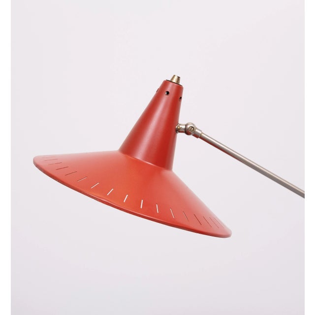 Very nice floor lamp with adjustable shade. newly rewired. The shade is repainted. The shade have some user marks. This...
