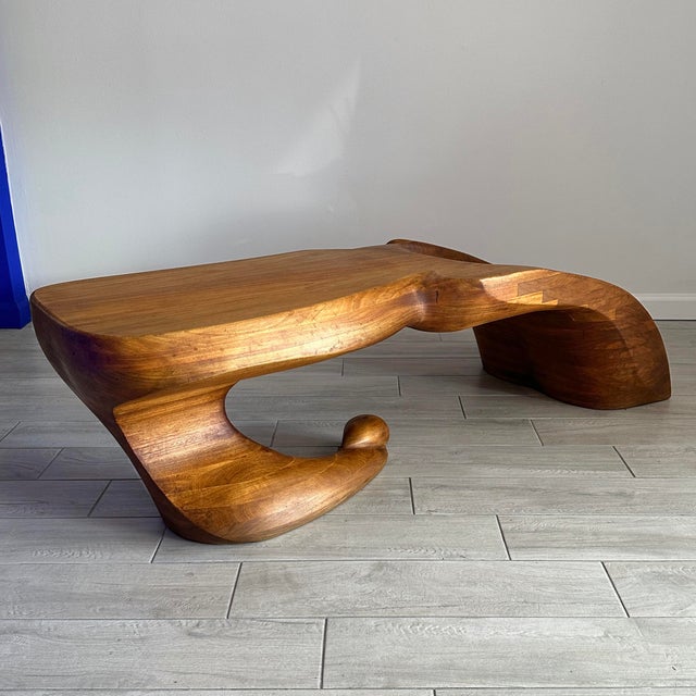 An exceptional woodworking example of biomorphic sculptured furniture by Ed Merklinger. Merklinger mastered the technique...