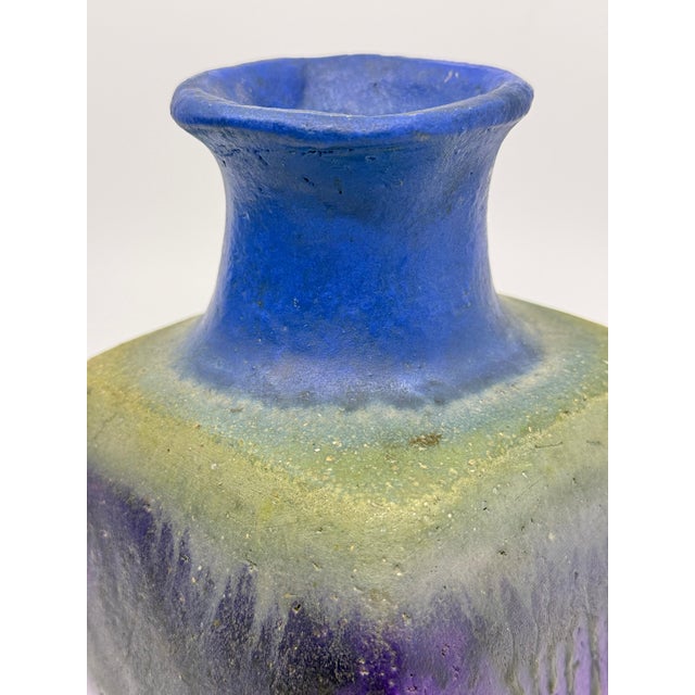 A beautiful drip glazed pottery vessel by Fantoni. It has a squarish shaped base with a round top. A stunning deep shade...