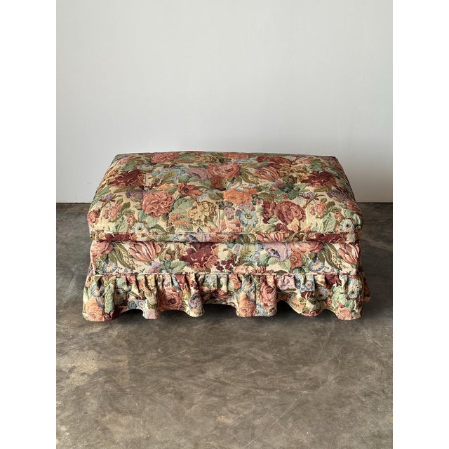 This vintage ottoman brings a deep box cushion, tufted and buttoned on top, paired with a gathered skirt that falls in...