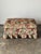 This vintage ottoman brings a deep box cushion, tufted and buttoned on top, paired with a gathered skirt that falls in...
